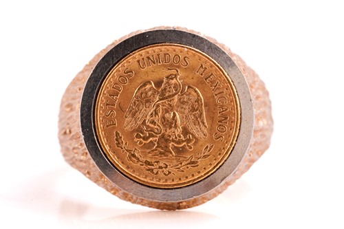 Lot 97 - A 9ct gold ring set with a Mexican dos peso,...