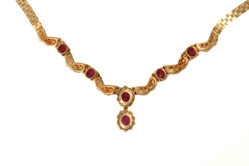 Lot 88 - A ruby and diamond necklace, the pendant...