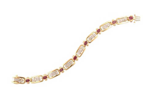 Lot 197 - A 14ct yellow gold, diamond, and ruby bracelet,...