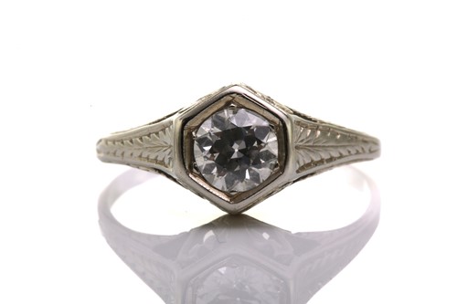 Lot 128 - A diamond solitaire ring, scintillating with...