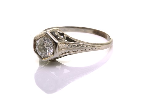 Lot 128 - A diamond solitaire ring, scintillating with...