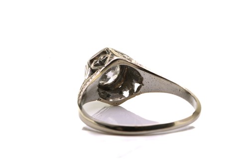 Lot 128 - A diamond solitaire ring, scintillating with...