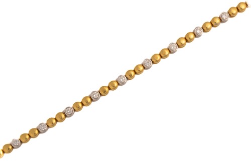 Lot 361 - A two-toned line bracelet set with diamonds,...