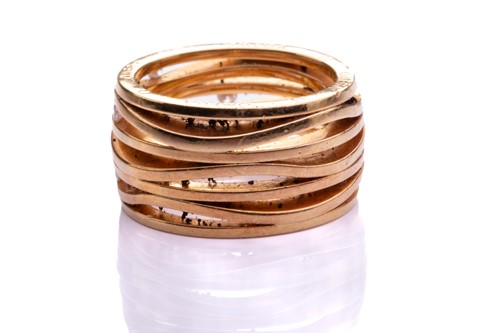 Lot 219 - Omega - A seven-row ring set with diamonds in...