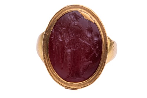 Lot 354 - A Roman carnelian intaglio ring, centrally set...