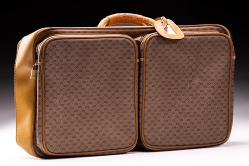 Lot 426 - Gucci - A leather and canvas suitcase, in...