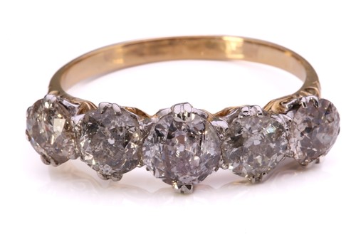 Lot 255 - A five-stone diamond half hoop ring,...