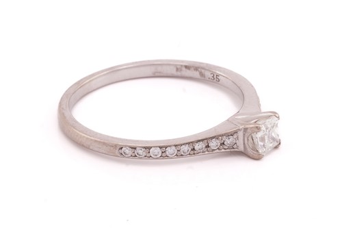 Lot 296 - A single stone diamond ring; the round...