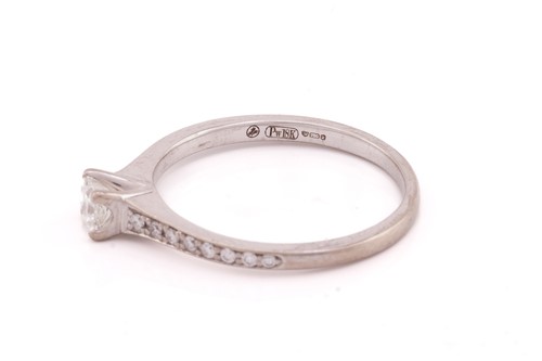 Lot 296 - A single stone diamond ring; the round...