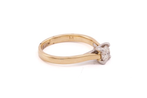 Lot 152 - A single stone diamond ring; the round...