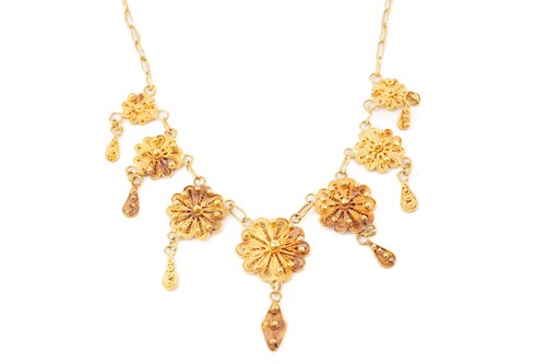 Lot 325 - A yellow gold filigree necklace, set with...