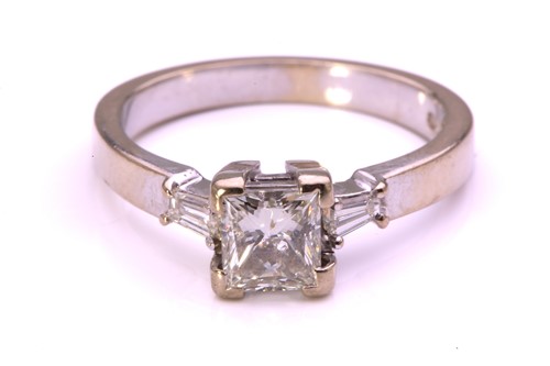 Lot 59 - A princess-cut diamond solitaire ring in 9ct...