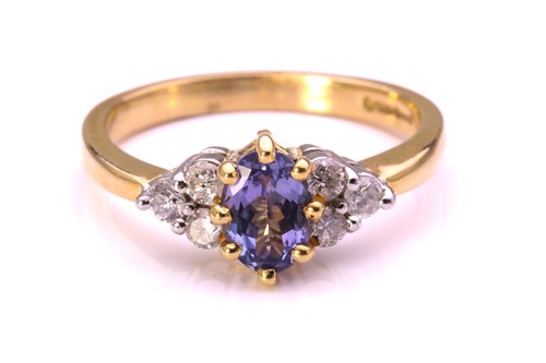 Lot 272 - A tanzanite and diamond ring in 18ct gold,...