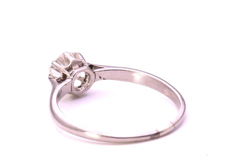 Lot 17 - An old-cut diamond solitaire ring, featuring a...