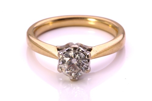 Lot 260 - A diamond solitaire ring in 18ct gold,...