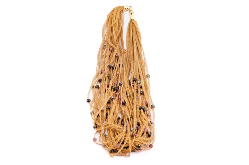 Lot 181 - A woven mesh and beaded necklace by Pietro...