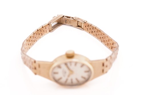 Lot 466 - A lady's Baume and Mercier watch, Girard...