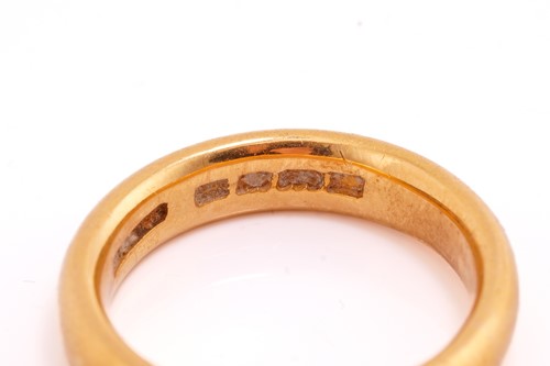 Lot 80 - A 22ct yellow gold wedding band, a cluster...