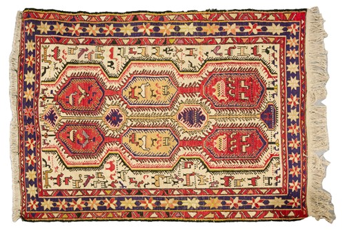 Lot 216 - A small ivory ground silk Soumak rug with...