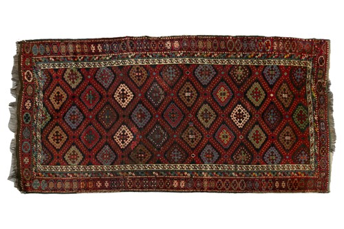 Lot 225 - An antique red ground probably Qasqai runner...