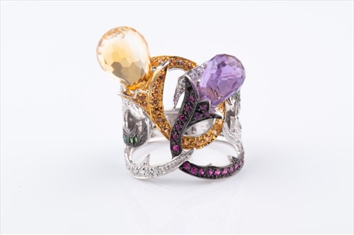 Lot 383 - An unusual diamond and gemstone cocktail ring...