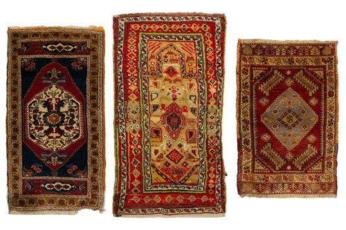 Lot 212 - An old Turkish red ground Taspina mat with a...