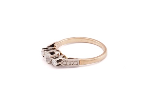 Lot 31 - A three stone diamond half hoop ring; the...