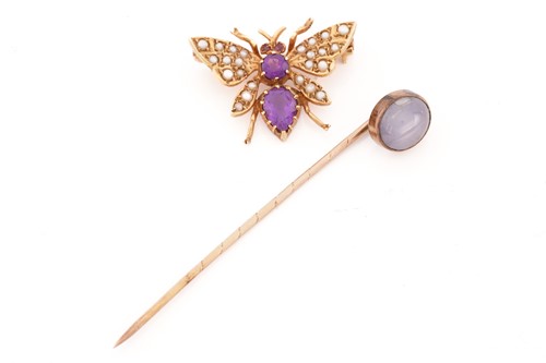 Lot 135 - An amethyst and seed pearl butterfly brooch...