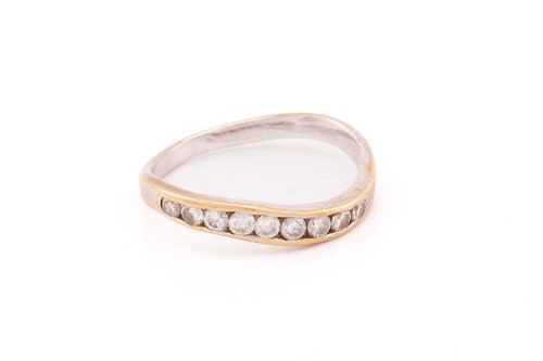 Lot 46 - A wavy half-eternity ring set with diamonds,...