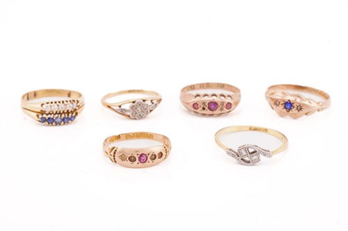 Lot 215 - A two row ten stone sapphire and diamond ring;...