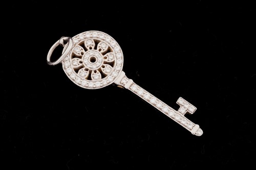 Lot 359 - Tiffany & Co. - A mini 'Petals Key' Pendant,...