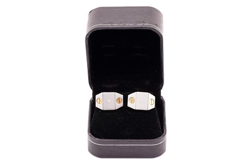 Lot 232 - A pair of two-toned cufflinks, with slotted...