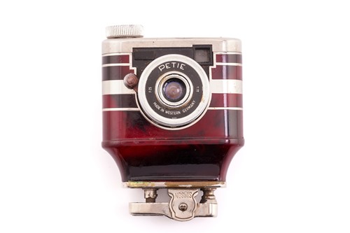 Lot 174 - A Petie camera lighter, W. Kunik Germany, red...