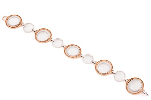 Lot 9 - A diamond hoop bracelet, the rose gold and...