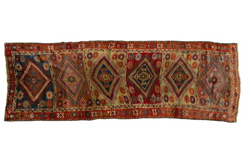 Lot 213 - An antique Turkish "Country House" runner with...