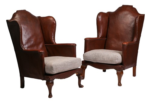 Lot 178 - A pair of early 20th-century wingback fireside...