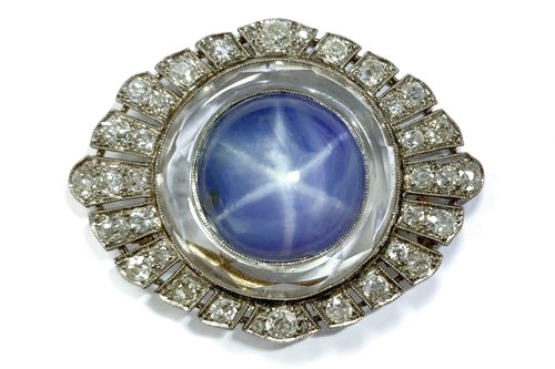 Lot 276 - Star sapphire and diamond brooch, circa 1920,...