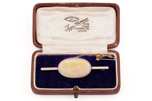 Lot 243 - A 9ct yellow gold and opal bar brooch,...