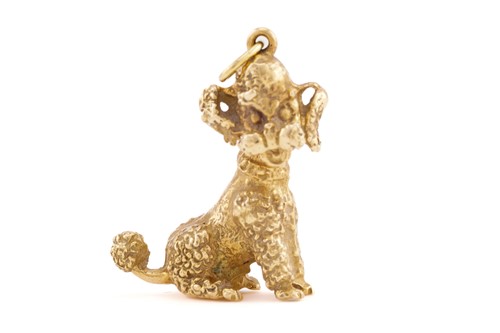 Lot 321 - A yellow metal pendant in the form of a poodle,...