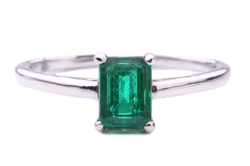 Lot 50 - An emerald solitaire ring, featuring an...
