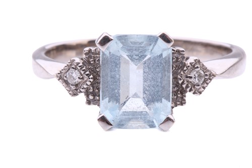 Lot 247 - An aquamarine and diamond dress ring in 18ct...