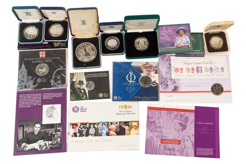 Lot 410 - A collection of silver proof coins, including...