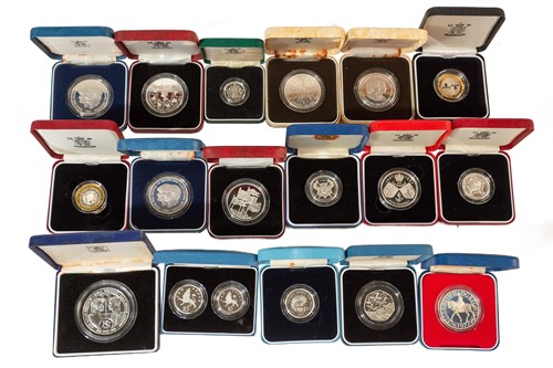 Lot 417 - A collection of seventeen boxed proof silver...