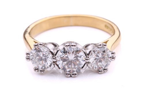 Lot 181 - A three-stone diamond half-hoop ring in 18ct...