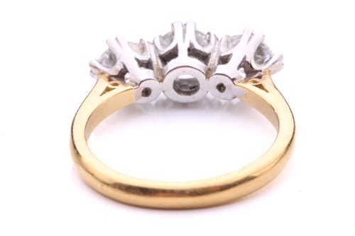 Lot 181 - A three-stone diamond half-hoop ring in 18ct...
