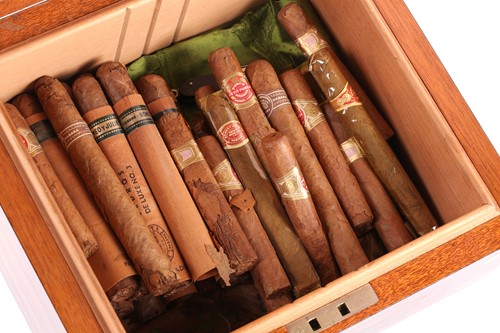 Lot 134 - A brass bound Coromandel humidor containing 13...