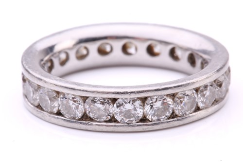 Lot 79 - A diamond eternity ring in platinum,...
