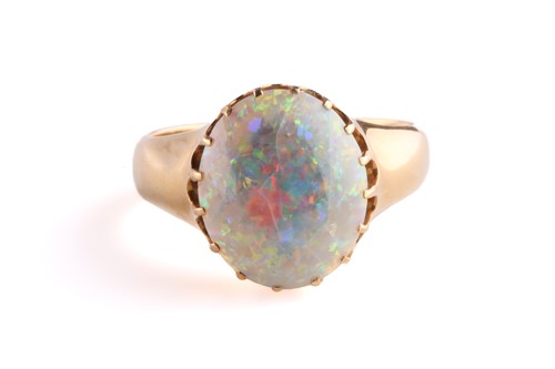 Lot 167 - A precious opal dress ring in 18ct yellow gold,...