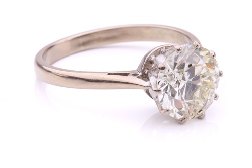 Lot 101 - A diamond solitaire ring, featuring a slightly...