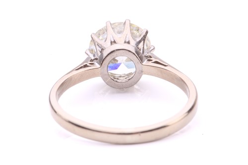 Lot 101 - A diamond solitaire ring, featuring a slightly...